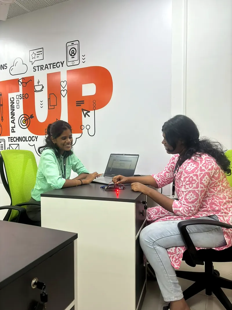 Two engineers bringing up a circuit board