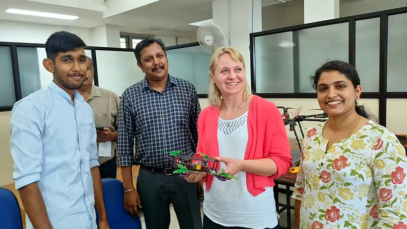An international visitor holding a Nexospark FPV drone